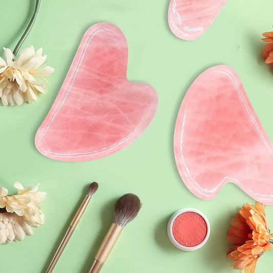 Gua sha facial massager used on face for lifting and sculpting